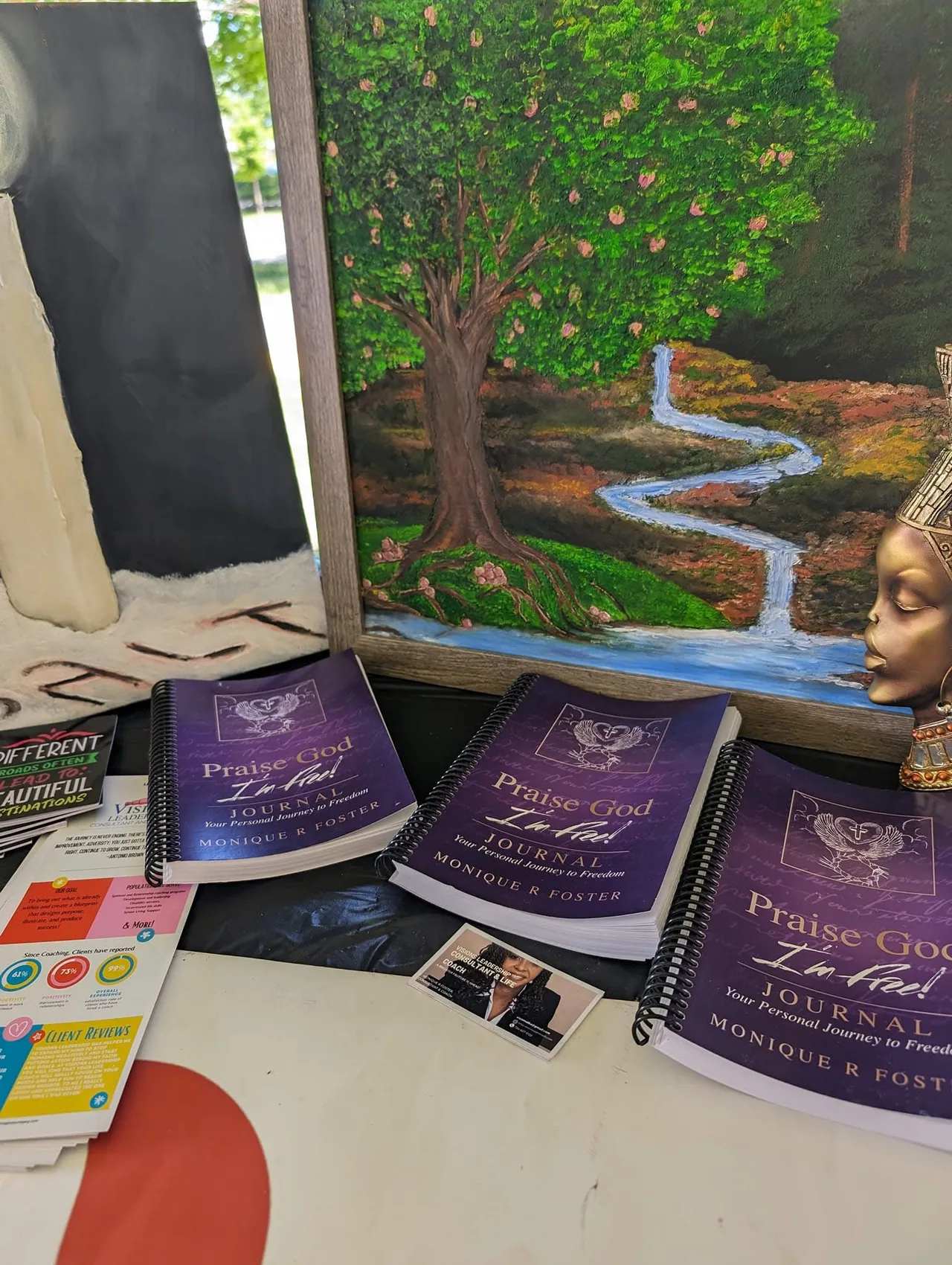 Copies of Monique Foster's published journal Praise God I'm Free with Visions business materials